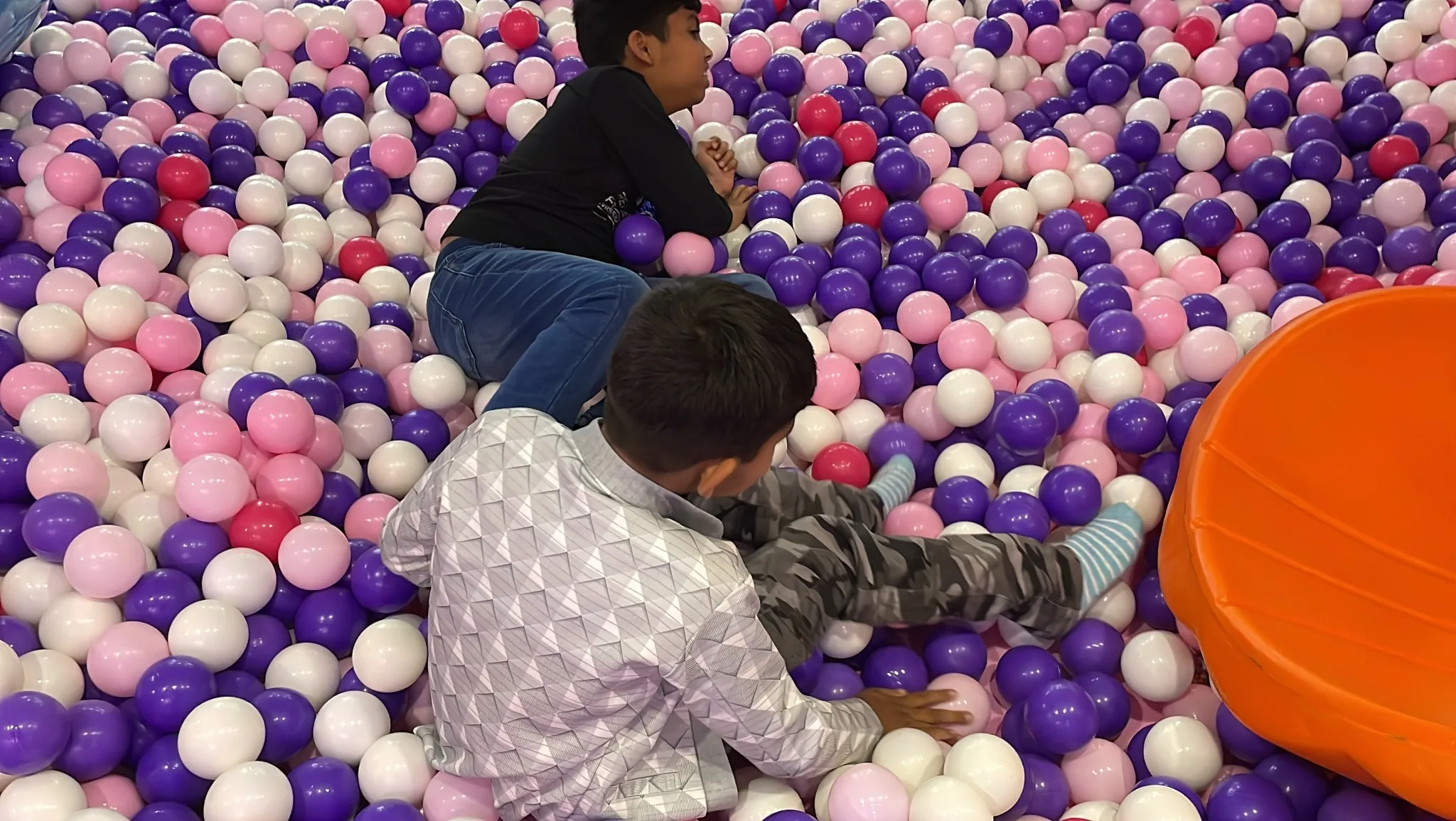 Children playing in ball pit