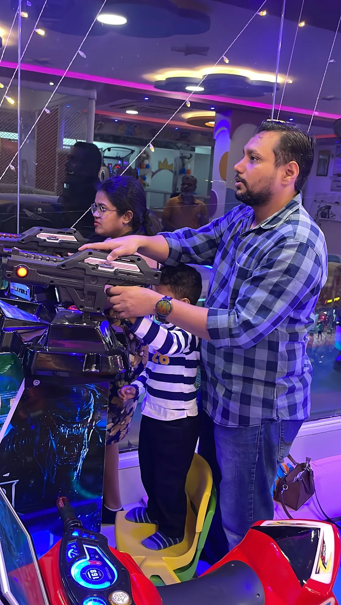 Family enjoying arcade games